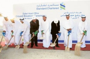     *  Shaikh Ahmad Bin Saeed Al Maktoum (fourth from right), President of Dubai Civil Aviation and Chairman and Chief Executive of Emirates Airline and Group; Peter Sands (third from right), Group Chief Executive; Ahmad Humaid Al Tayer (second from right), Governor of DIFC, and V. Shankar (fourth from left), CEO of Europe, Middle East, Africa and the Americas, are joined by other guests and officials during a ground breaking ceremony in Emaar Square to mark the start of construction of the new Standard Chartered Bank’s Dubai head office.     * Image Credit: Megan Hirons Mahon/Gulf News