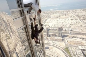 Image from imdb.com  Tom Cruise hangs out of the tallest building in the world - the Burj Khalifa tower in Dubai, India - for a scene in "Mission: Impossible - Ghost Protocol." Cruise allegedly performed this stunt and others without the use of a stunt double.